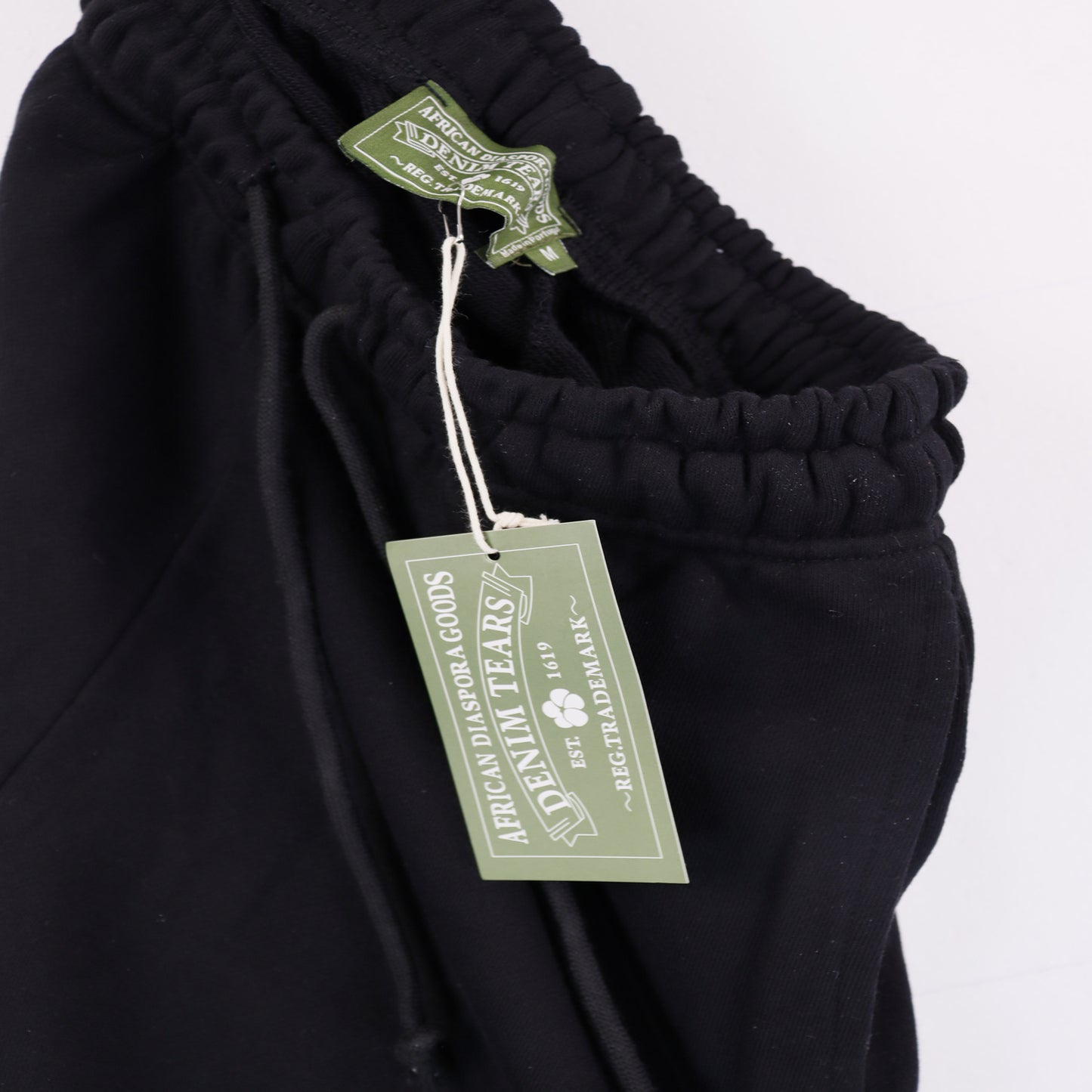 DENIM TEARS BLACK SHORTS BIG COTTON WREATH