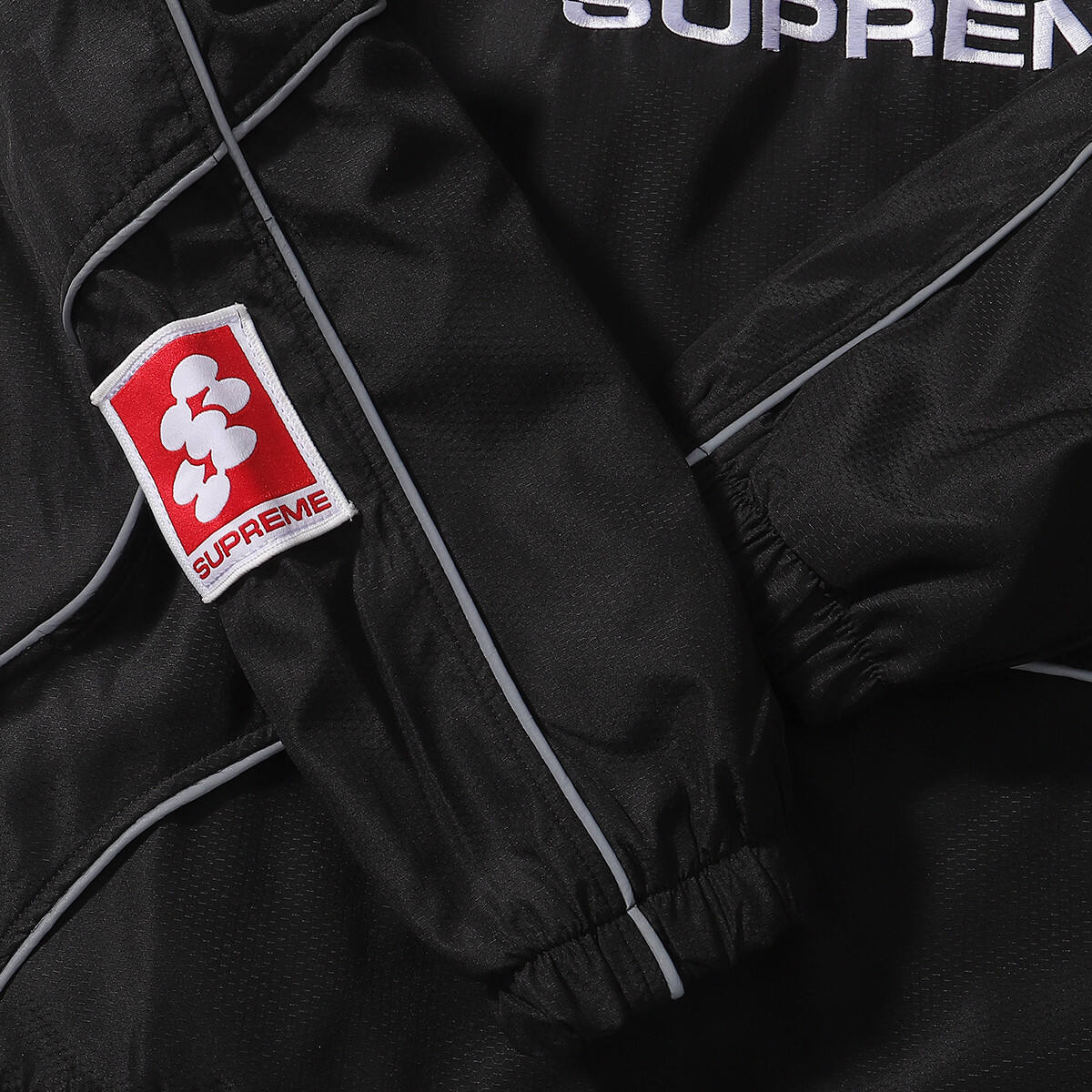 SUPREME FW24 WEEK11 REFLECTIVE PIPING BLACK PULLOVER