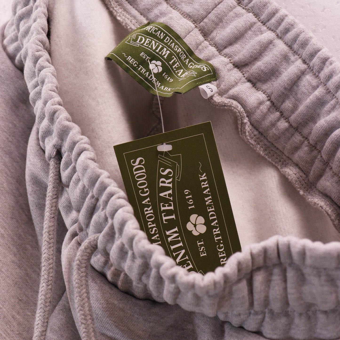 DENIM TEARS GREY SHORTS