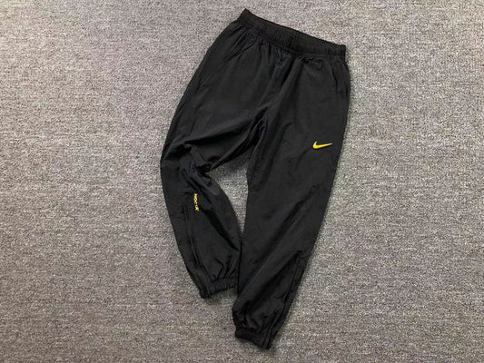 NIKE X DRAKE NOCTA TRACK BLACK AND YELLOW PANTS